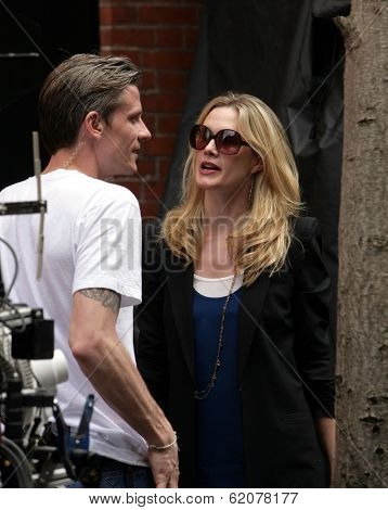 NEW YORK CITY - APRIL 15: Former SVU star Stephanie March (R) admires a tattoo on the arm of a crew member on the set of 