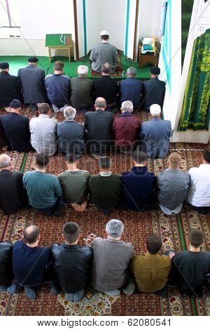 NOVI PAZAR, SERBIA - APRIL 28: Muslim men pray in the southern Serbian city of Novi Pazar, near the borders of Montenegro, Kosovo and Bosnia, worship at a local mosque on April 28, 2002 in Novi Pazar, Serbia.