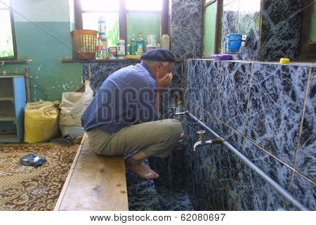 PRISTINA, KOSOVO, 21 JULY 2002 - Muslim men come to Friday prayers at a local area mosque in the center of Pristina, Kosovo.