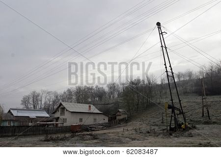 PLOIESTI , ROMANIA - NOV 8: A lone pump jack owned and operated by Romanian oil and gas company S.C. Petrom S.A. pulls crude oil out of the ground near Ploiesti, Romania, on Thursday, November 8, 2007.