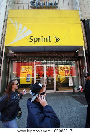 NEW YORK CITY - APRIL 19: People walk past a Sprint mobile telecommunications retail outlet  in New York City, on Friday, April 19, 2013.