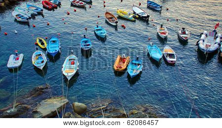 RIOMAGGIORE - ITALY: AUG 17: Boats in the marina in Riomaggiore, Italy, on Sunday, August 17, 2013. The village is one of five making up Cinque Terre. 