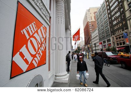 NEW YORK CITY - OCT 23 2013: Shoppers walk past The Home Depot retail home improvement store in Manhattan on Wednesday, October 23, 2013.  
