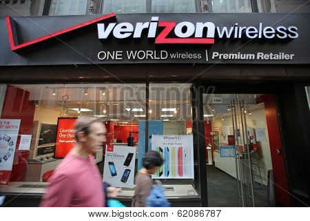 NEW YORK CITY - OCT 17:  Pedestrians walk past a Verizon Wireless retail outlet in Manhattan on Thursday, October 17, 2013. 