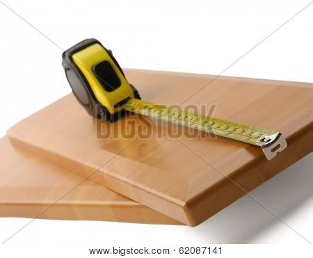 Wooden board and tools on a white background