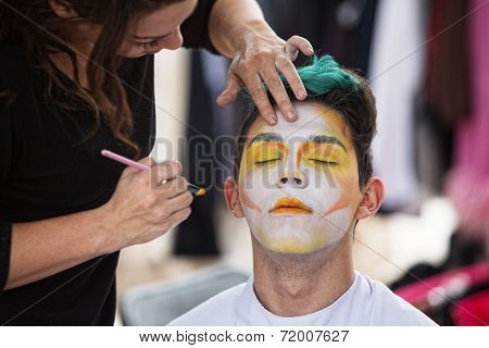 Sylist Putting Makeup On Clown