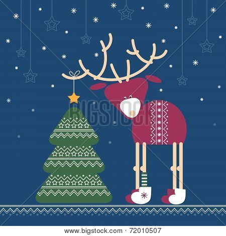 Deer decorates a Christmas tree with star in the night