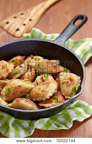 Dumplings fried with onion
