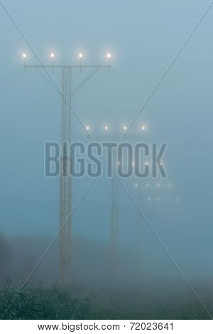 Landing Lights At A Airport During Foggy Weahter