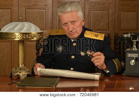 Military mature general on the table