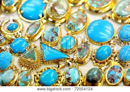 Golded jewel with turquoise