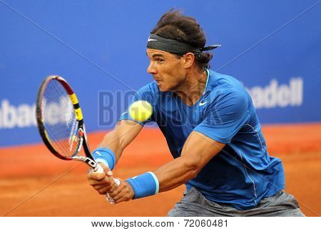 BARCELONA - APRIL, 24: Spanish tennis player Rafa Nadal in action during a match of Barcelona tennis tournament Conde de Godo on April 24, 2014 in Barcelona