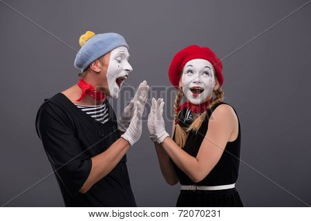 Portrait of funny mime couple with white faces and emotions