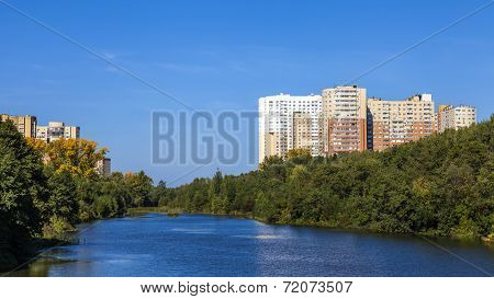 City landscape. Houses on river banks