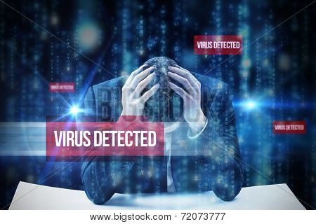 The word virus detected and businessman with head in hands against lines of blue blurred letters falling
