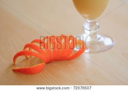 Milk cocktail with orange and carom