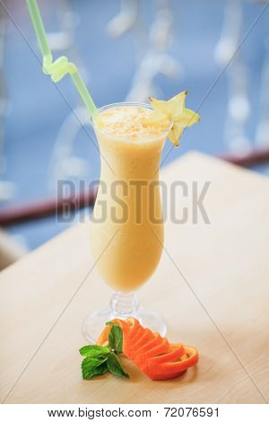 Milk cocktail with orange and carom