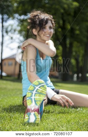 Two Young Girls Stetching Before A Jogging