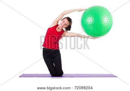Young woman exercising with swiss ball