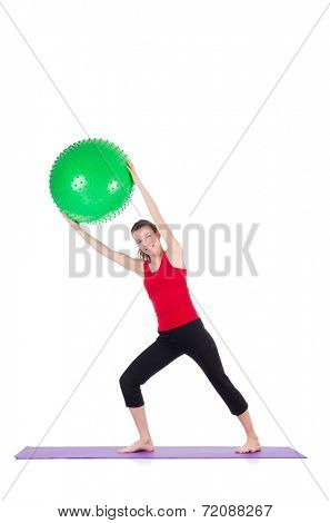 Young woman exercising with swiss ball