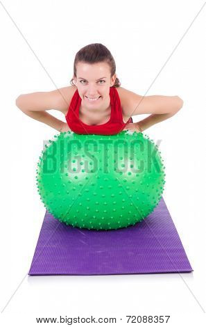 Young woman exercising with swiss ball