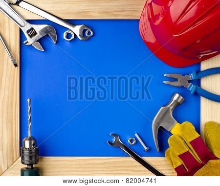 Tools And Helmet In A Wooden Frame