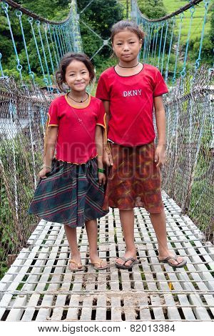 Little Nepalese Girls On Rope Hunging Suspension Bridge