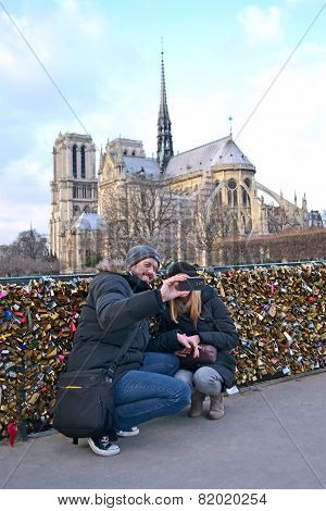 Paris - Dec 30: Tourists Making Photo Near The Notre-dame Cathedral (aka Cathedral Notre Dame De Par