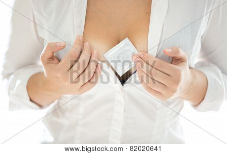 Woman In White Shirt Showing Condom Between Big Breast