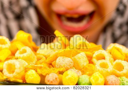 young girl overeating junk food