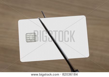 Scissors Cutting A Credit Or Debit Card