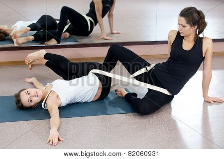 Two Yogi Female Practicing Yoga Therapy In Class