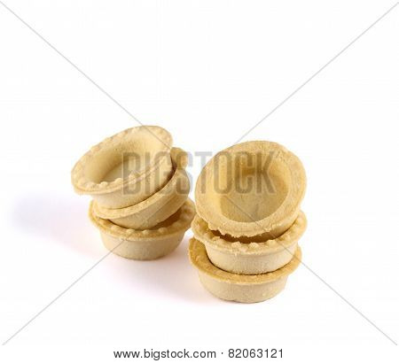 Pile of empty tartlets isolated