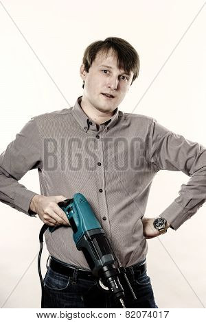 Young Man With Electric Drilling Machine Isolated On White