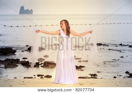 Bride Whirls On Sandy Beach