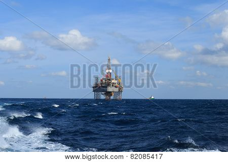 Offshore Jack Up Drilling Rig Over The Production Platform In The Middle Of The Sea