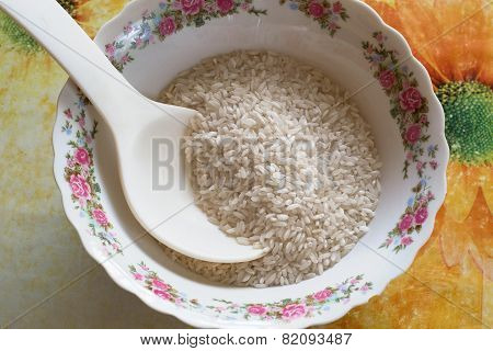 Rice In A Large White Plate With Spoon