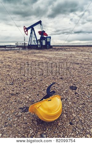 Pumpjack Oil Pump And Protective Helmet