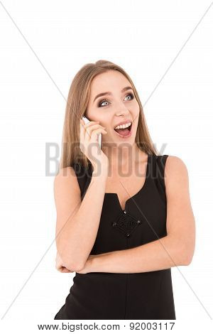 Girl In A Black Dress On A White Background. Girl Talking On The Phone