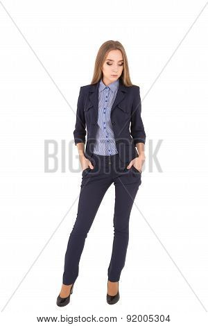 Young Successful Woman In A Business Suit On A White Background. Serious Girl
