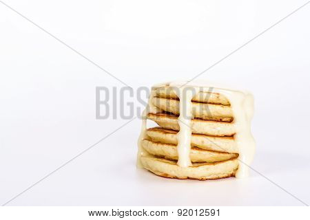 isolated deset - stack of several pancake with condensed milk