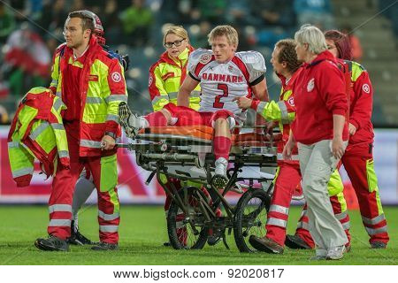 GRAZ, AUSTRIA - MAY 31, 2014: LB Timmi Kleinnibbelink Rysgaard (#2 Denmark) is transported off the field after an injury.