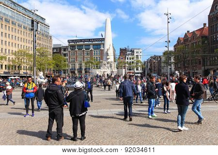 Locals and tourist at Amsterdam's Dam square