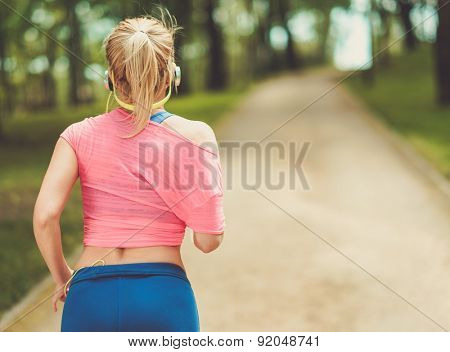 Woman running in a park 