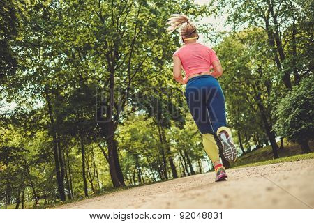 Woman running in a park 