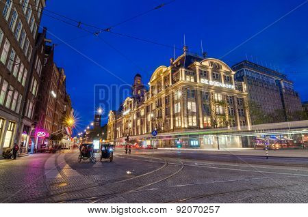 Amsterdam, Netherlands - May 7, 2015: Tourist Visit De Bijenkorf Store On Dam Square
