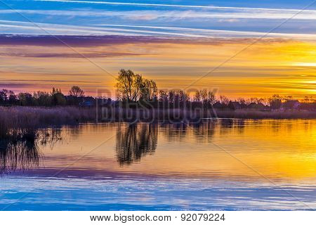 Sunset In Zinnowitz With Reflection On The Water