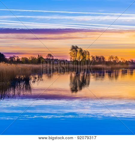 Sunset In Zinnowitz With Reflection On The Water