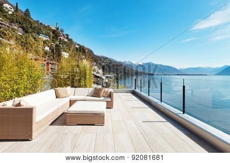 modern architecture, beautiful lake view from the terrace of a penthouse