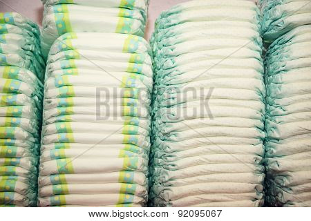 Children's Diapers Stacked In A Many Piles